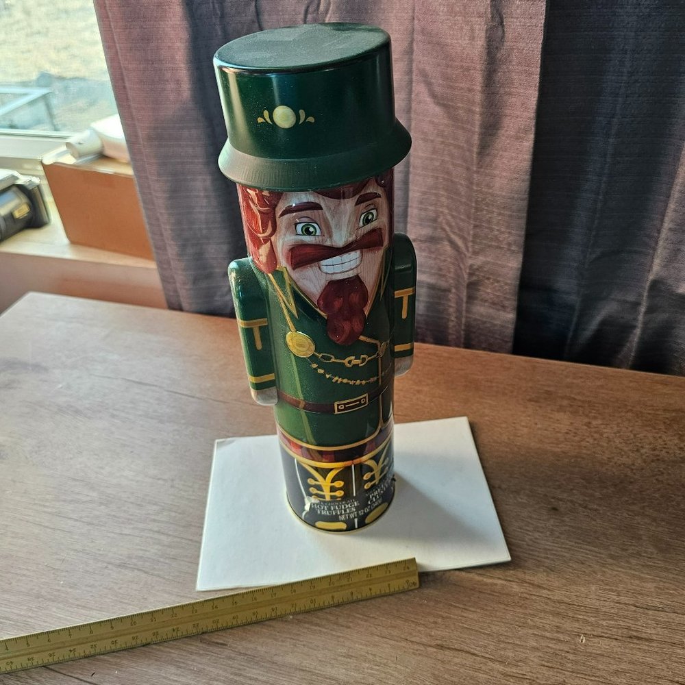 vintage green suited man storage can